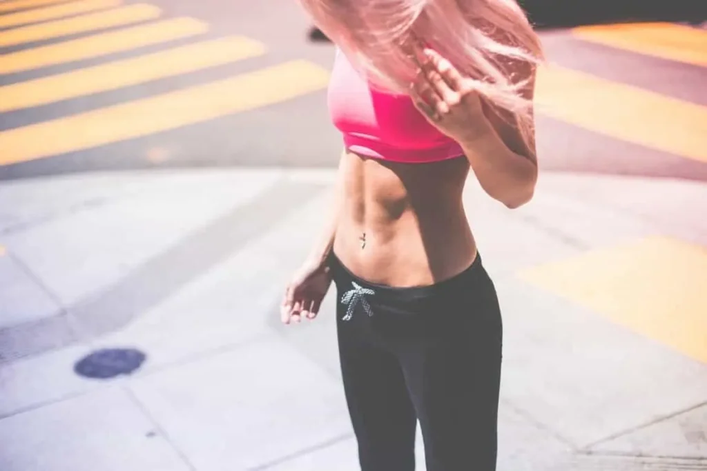 Woman with toned stomach after LA-EMS Body Sculpting Treatment Old Oak Common