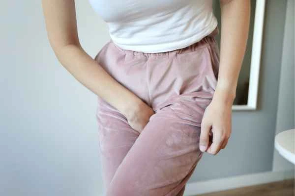 woman running for the toilet because of urinary incontinence Old Oak Common